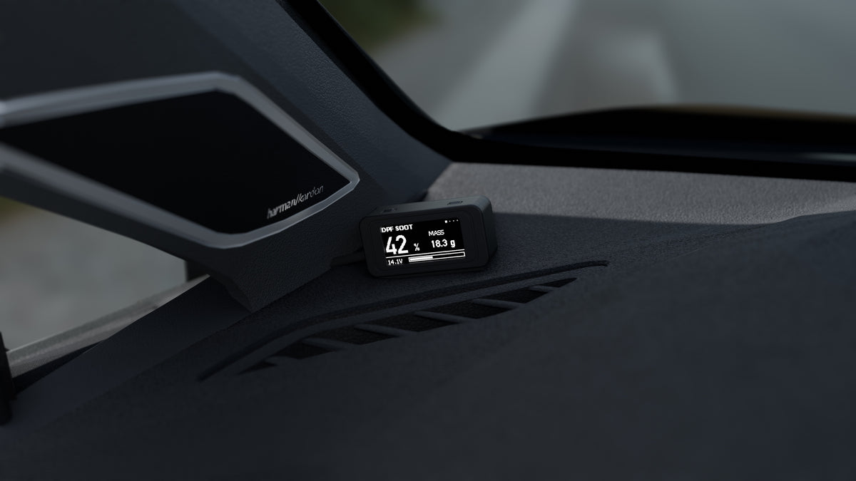 Close-up of the DPF Controller display on the dashboard by the A-pillar, showing the DPF soot load